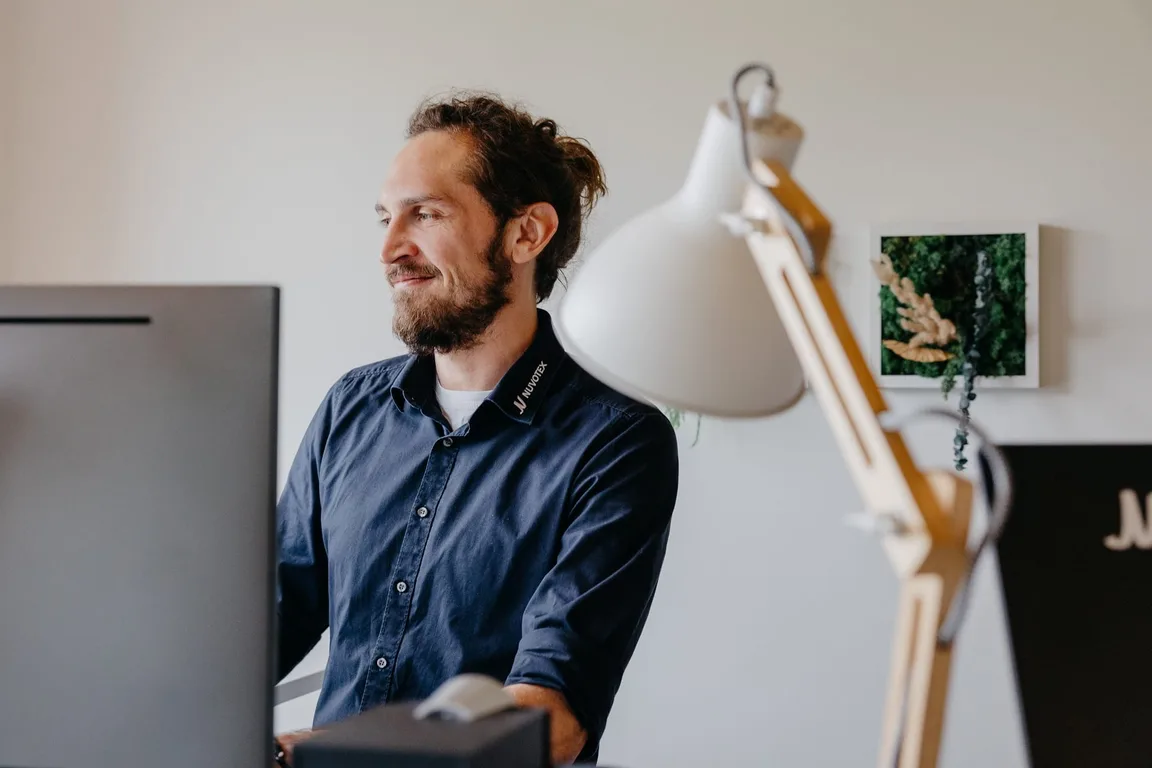 About page mission section — Nuvotex team member at work